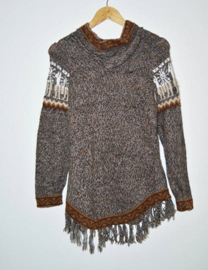 Handmade alpaca wool sweater with brown accents and fringe hem, featuring traditional patterns on sleeves.