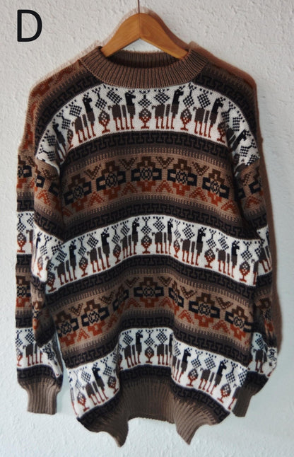 Handmade alpaca wool sweater with brown, white, and black geometric patterns and ribbed cuffs.