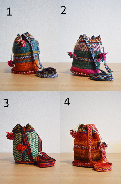 Four small handmade alpaca shoulder bags with colorful traditional Andean patterns, each featuring a drawstring closure and.