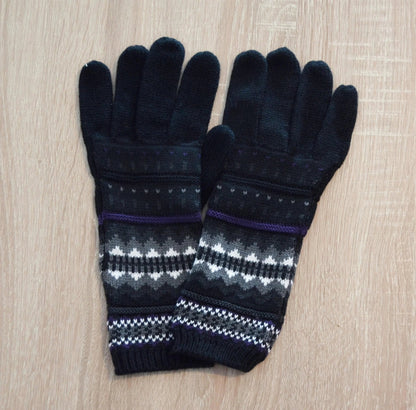 Black handmade alpaca gloves with white and purple geometric patterns on cuffs.