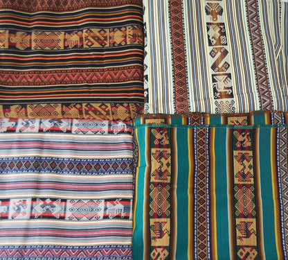 Four handmade alpaca blankets with intricate colorful Andean patterns in earthy tones of green, brown, yellow, and white.