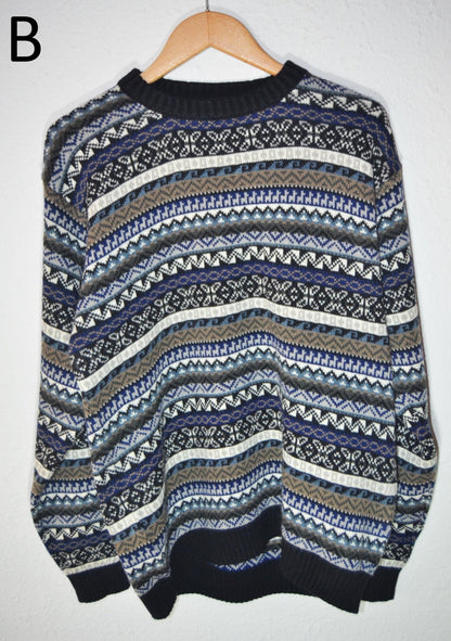 Handmade alpaca wool sweater with blue, gray, and cream intricate patterns, ribbed cuffs and hem.