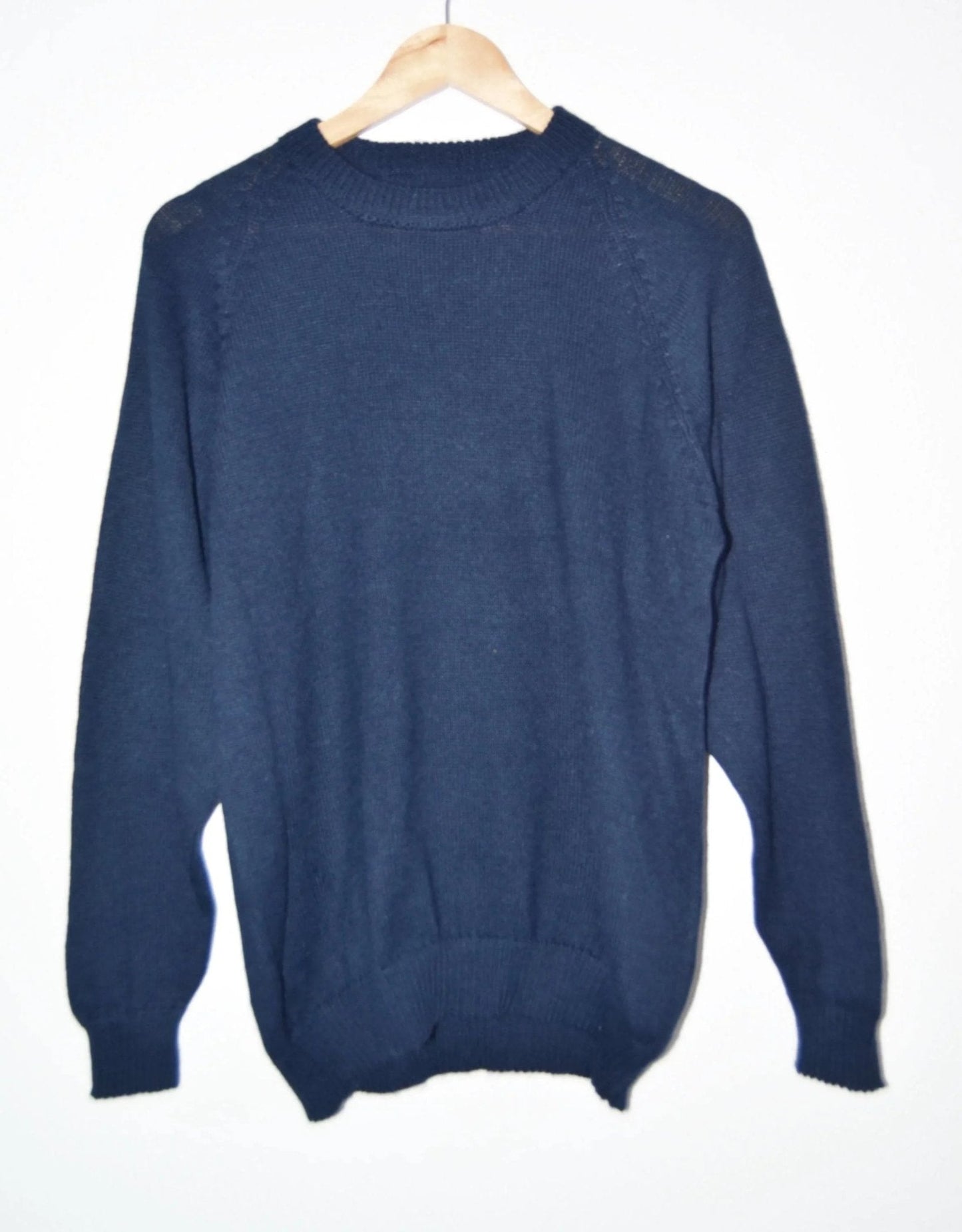 Handmade navy blue alpaca wool sweater with crewneck and ribbed cuffs and hem.
