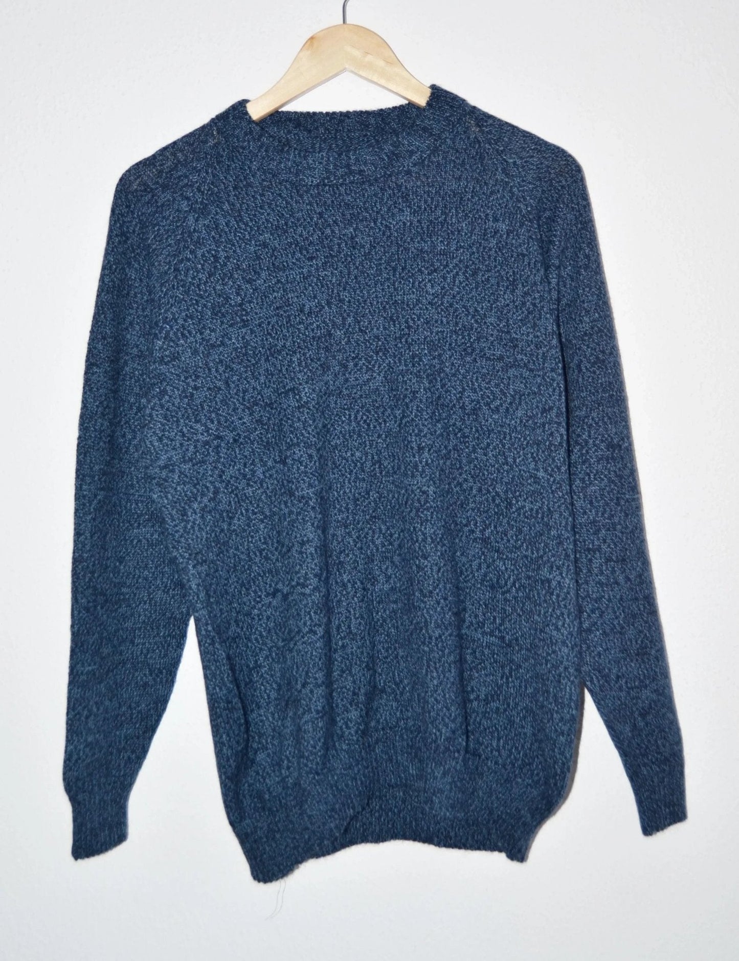 Handmade navy blue alpaca wool sweater with crew neck and long sleeves.