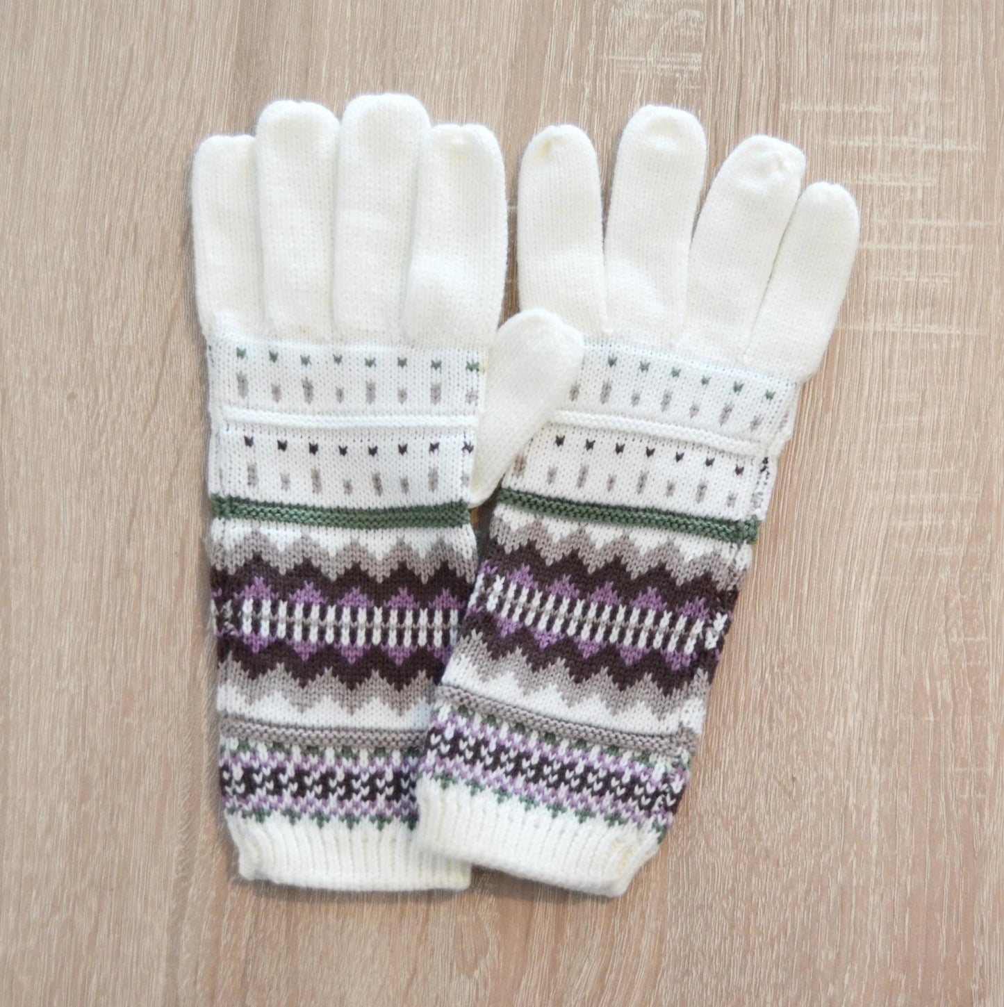 Handmade white alpaca gloves with geometric purple and gray pattern on cuffs.