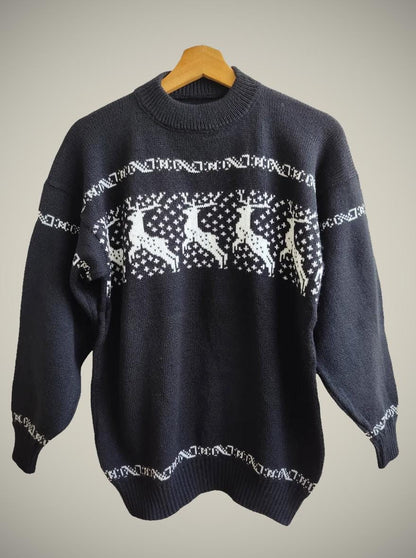 Handmade black alpaca sweater with white reindeer and snowflake pattern, crew neck.