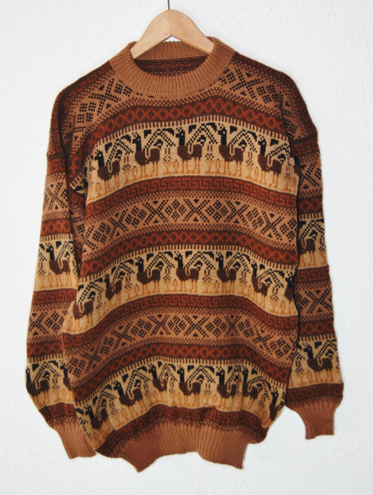 Handmade alpaca sweater with brown and beige geometric and animal patterns, wide fit.