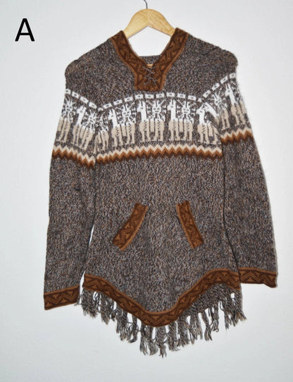 Handmade alpaca sweater with brown geometric patterns, front pockets, and fringe hem.