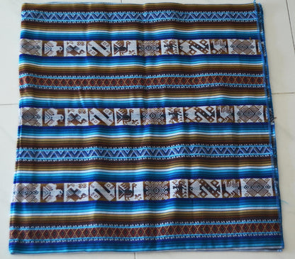 Handmade alpaca fabric with blue, brown, and white geometric Andean patterns textile.