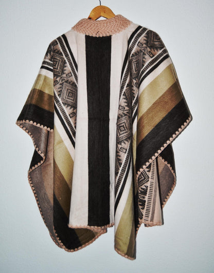 Handmade alpaca wool poncho shawl in earthy tones with traditional geometric patterns and soft texture.