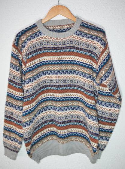 Handmade alpaca wool sweater with multicolor horizontal geometric patterns in blue, brown, and cream tones.