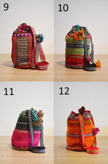 Four small handmade alpaca shoulder bags in vibrant colors with traditional Peruvian patterns and drawstring closures.